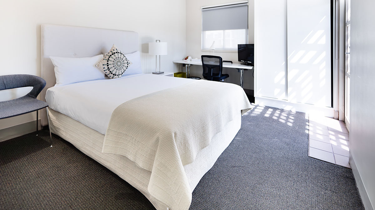 Our comfortable onsite residencies are hotel-style modern rooms, each with a queen bed and private ensuite.