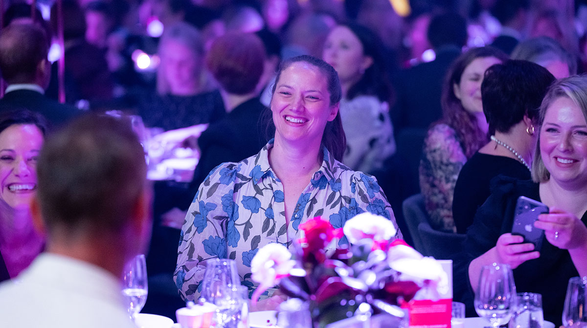 Women smiling in crowd