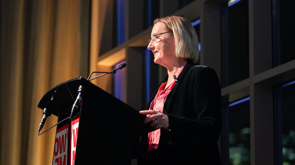 Woman giving speech at lectern