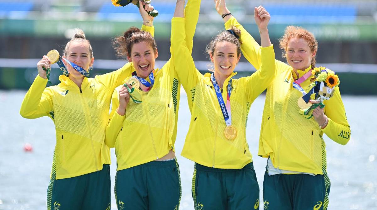Lucy Stephan, Rosemary Popa, Jessica Morrison and Annabelle McIntyre celebrate their gold medal win at the Tokyo Olympics. Photo supplied by Rowing Australia