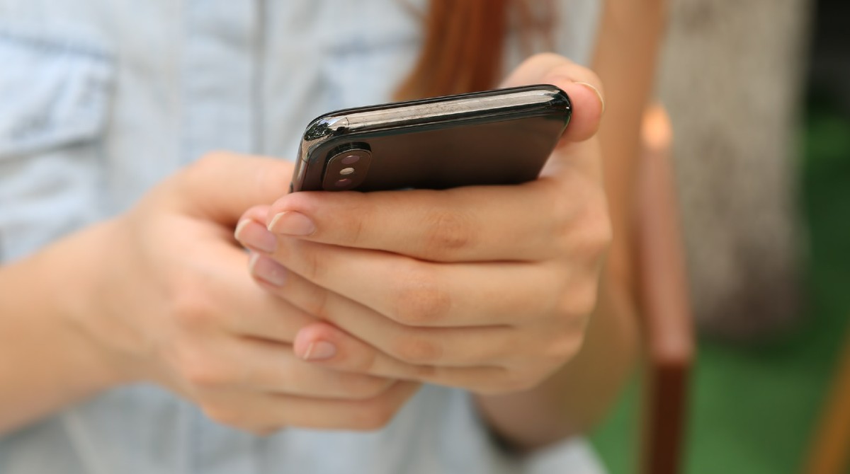 Person holding a mobile phone