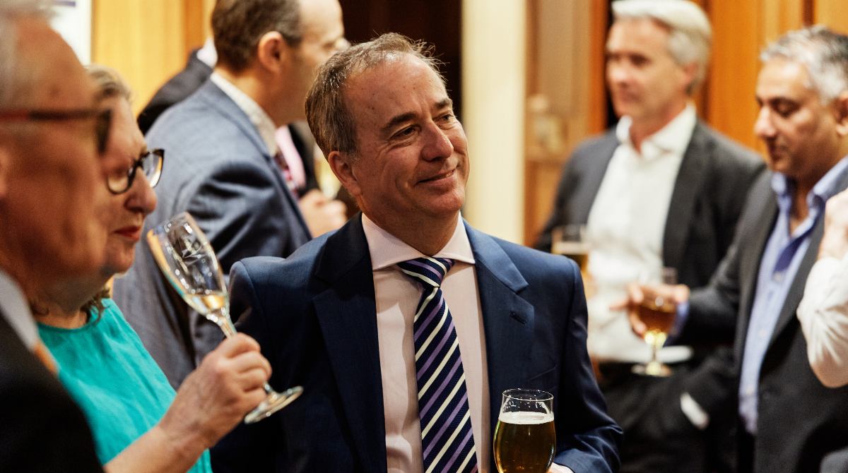 Melbourne-Business-School-Senior-Executive-MBA-Class-of-2003-members-enjoying-conversation-at-20-year-reunion
