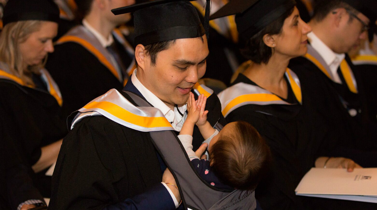Melbourne Business School graduate Joel Ng and his daughter Arielle